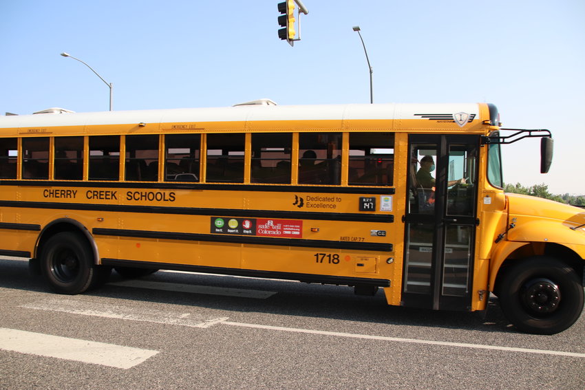 A Cherry Creek School District bus rolls past Grandview High School in August 2021 in the east Centennial area.
